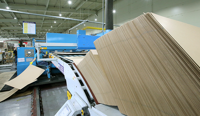 An employee removes faulty products during the quality check process.