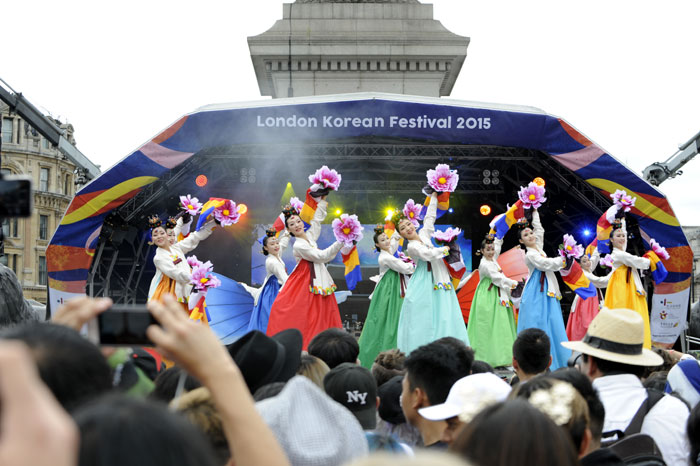 Performers from YMH Dance perform a fan dance at an outdoor stage at Trafalgar Square in central London on Aug. 9, part of the London Korean Festival 2015.