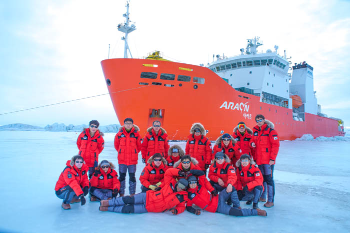 Jang Bogo Station staff pose before the icebreaker Araon. 
