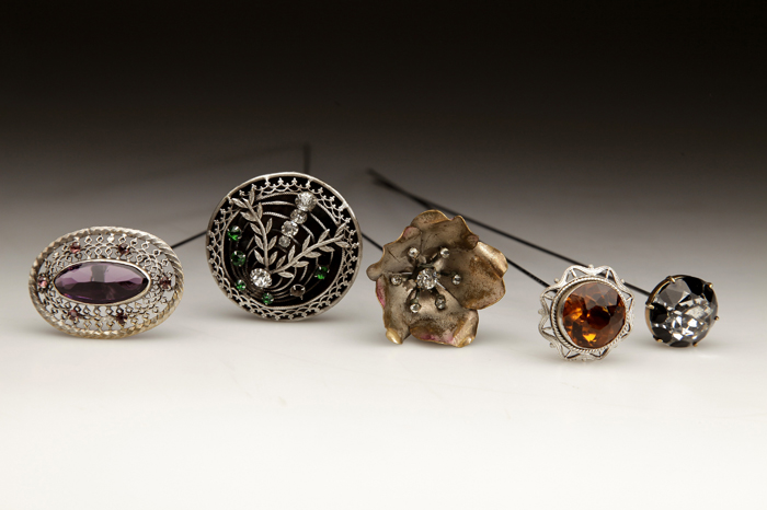  Female hair accessories produced in the 19th and 20th century are designed to clip a cap to the hair. 