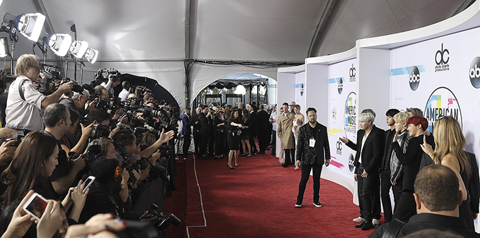 Photographers snap shots of BTS at the 2017 American Music Awards, in Los Angeles on Nov. 19.