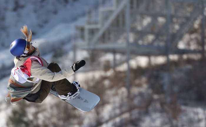 Austria’s Anna Gasser performs in the air in the women's snowboard big air finals at the Alpensia Ski Jumping Center in Pyeongchang, Gangwon-do Province, on Feb. 22.
