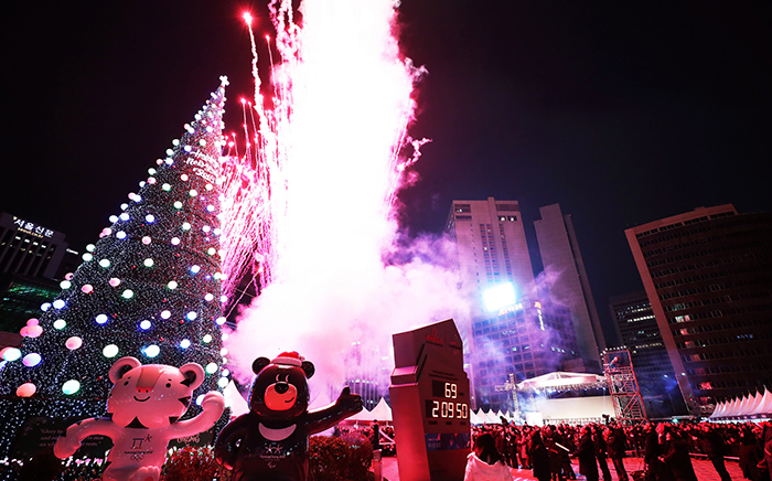 A lighting ceremony for a giant Christmas tree is held at Seoul Plaza on Dec. 2. The tree is next to statues of the two mascots for the PyeongChang 2018 Olympic and Paralympic Winter Games, Soohorang the white tiger and Bandabi the Asiatic black bear, and a clock tower that's counting down the days to the Winter Games Opening Ceremony in February next year.