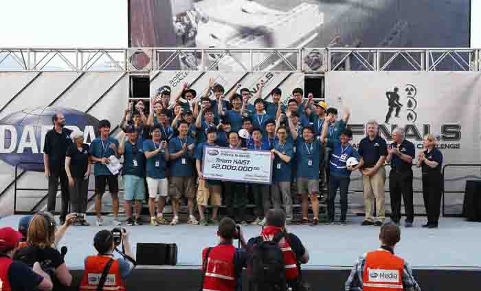Team KAIST celebrates its victory at the finals of the DARPA Robotics Challenge.