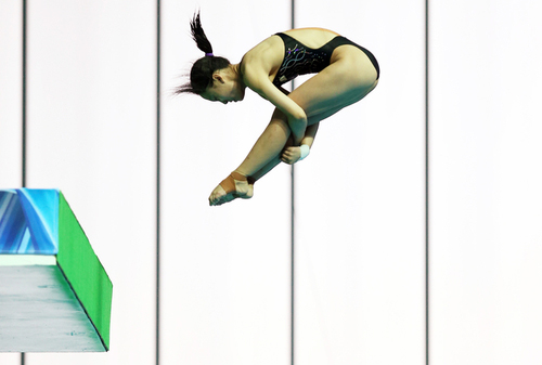Gwangju Summer Universiade gold medalist Wang Ying from China dives in the women's platform diving competition.