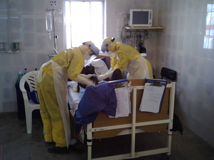 Emergency workers look after Ebola patients in Goderich, Sierra Leone. They always wear protective clothing and gear to prevent potential infection. 