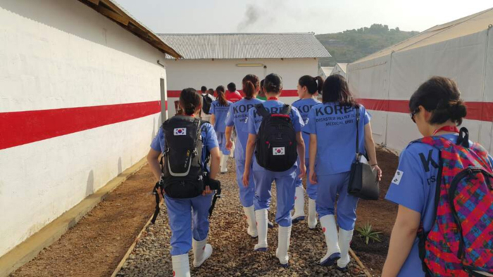 Rescue workers are dispatched to a clinic in Goderich, Sierra Leone. 