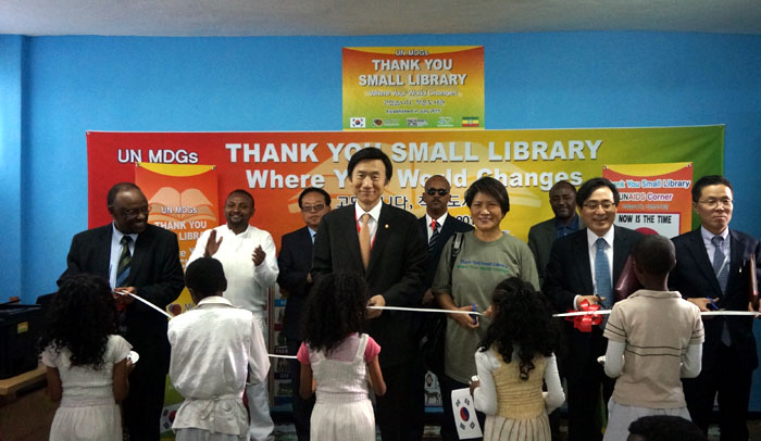 Participants cut the ribbon to mark the opening of the Thank You Small Library at the Major-General Hayelom Araya Primary School in Addis Ababa on July 13.