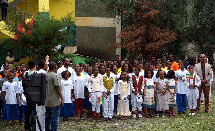 Students at the Major-General Hayelom Araya Primary School in Addis Ababa sing together to celebrate the opening of the Thank You Small Library on July 13.