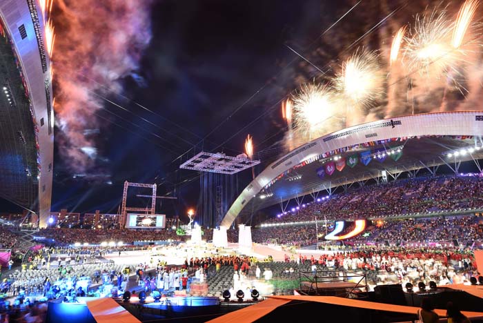 Fireworks light the sky after the Universiade flame is lit during the opening ceremony for the 2015 Gwangju Summer Universiade.