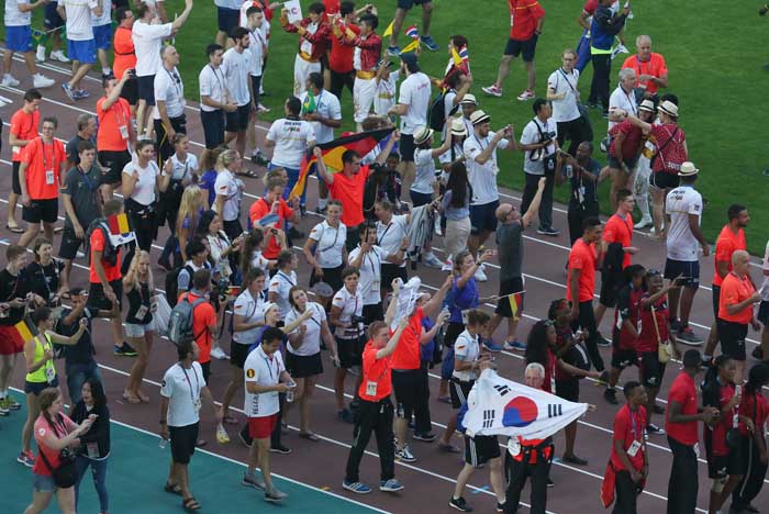 Athletes and officials from around the world march into the stadium together, regardless of their nationality, during the closing ceremony on July 14.