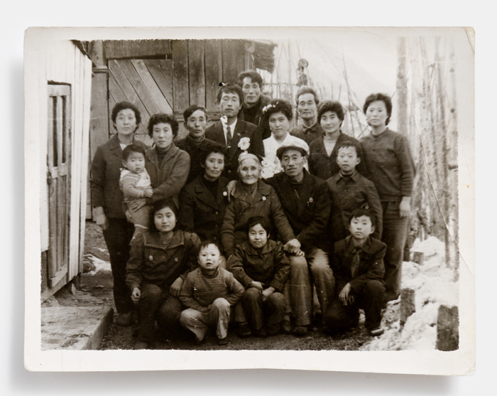 (Top) The A-501 is one of the first radios produced in Korea. (Bottom) The family photograph of a North Korean defector.