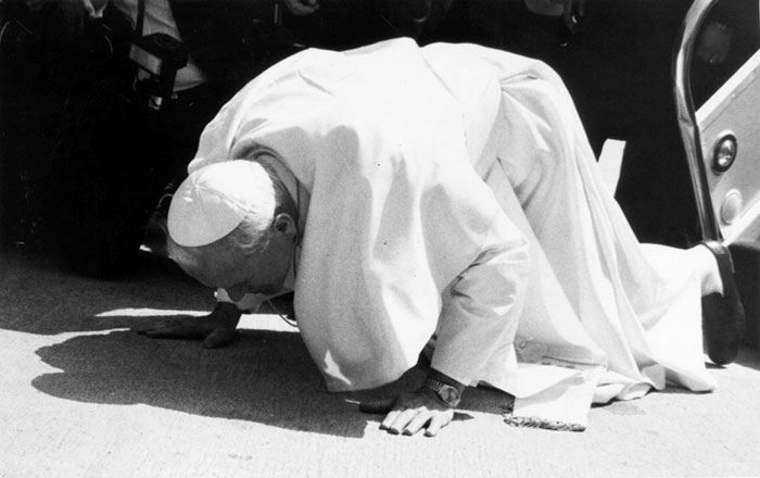 Pope John Paul II kisses the ground after landing at Gimpo International Airport on May 3, 1984. (photo courtesy of the National Archives of Korea)