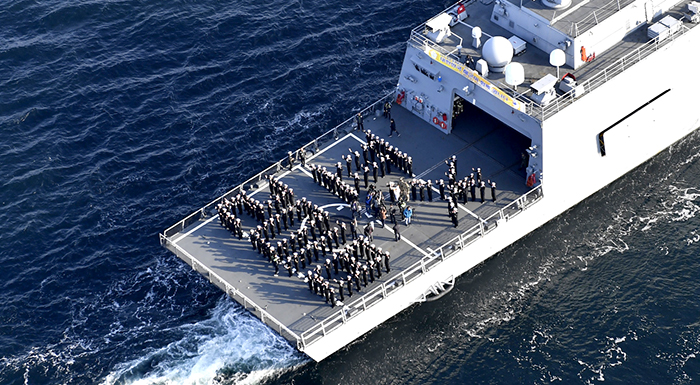 The navy crew and the Olympic torch bearer onboard the ROKS Munmu the Great (DDH-976) create the official emblem of the PyeongChang 2018 Olympic and Paralympic Winter Games, off the coast of Jinhae-gu District in Changwon City on Nov. 14. (Republic of Korean Navy)