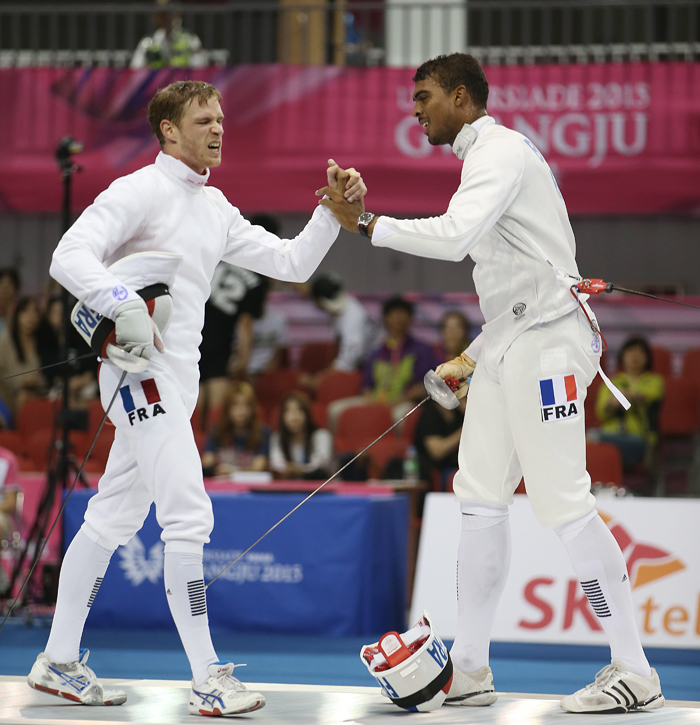 Yannick Philippe Andre Borel from France (right) shakes hands with Virgile Michel Louis Marchal also from France in the men's epee individual final after winning the gold medal.