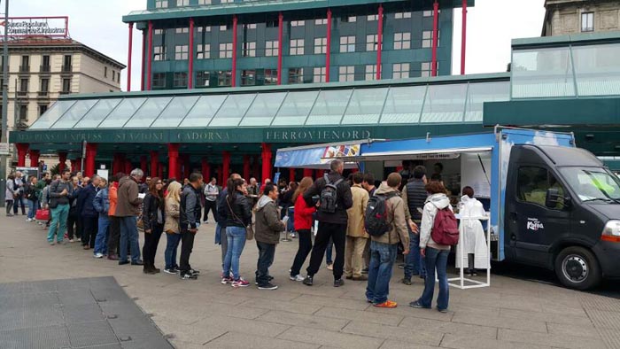 Hungry people line up in front of the Korean food truck to taste Korean cuisine.