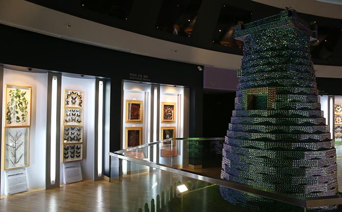 A replica Cheomseongdae, an ancient observatory tower in Gyeongju, is covered with the wings of over 40,000 beetles. A beetle's wing color does not change over thousands of years and the bugs have long symbolized wealth and longevity.