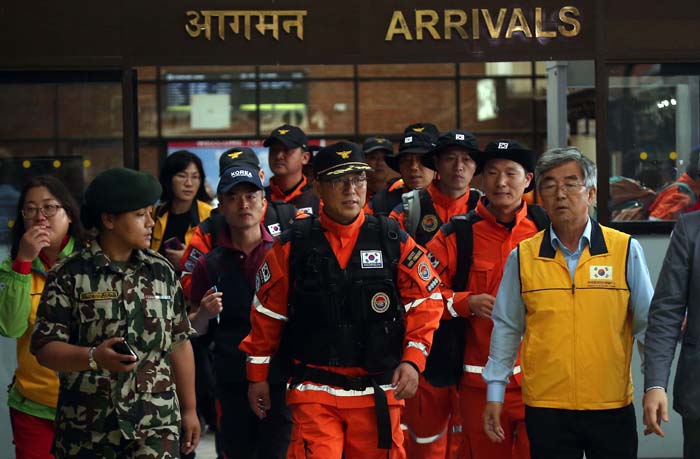 Relief workers and a search and rescue team arrive in Kathmandu, Nepal, on April 28.