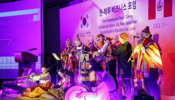 Traditional Korean and Peruvian music is performed at an opening event for the business forum.