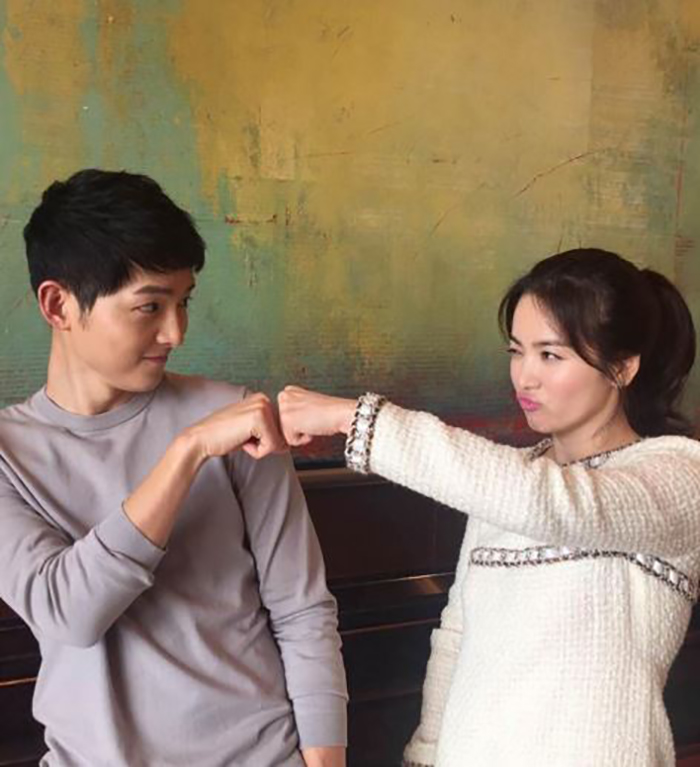 Song Joong-ki and Song Hye-kyo, called the “Song-Song Couple,” pose playfully.