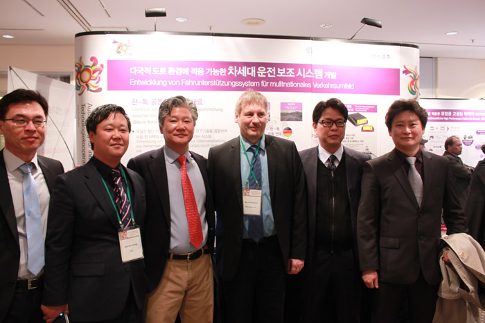 Korean and German officials participate in an exhibit of next-generation driving assistance systems developed through joint research, in March 2014. 