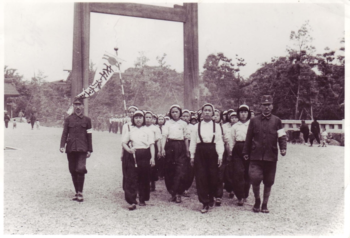 Young Korean girls in June 1944 brought to Mitsubishi Nagoya Aircraft Works in Japan for forced labor march with their Japanese instructors at Atsuta Shrine in Nagoya. (Civic Alliance Supporting Korean Women Victims of Forced Labor)