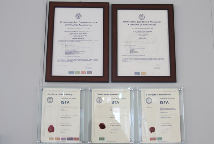 The ISTA certificates of accreditation are mounted on the wall at the Seed Testing and Research Center. 