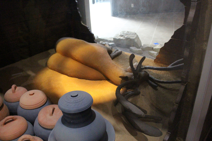 A replica of one of the Okjeon tombs shows many of the buried artifacts, including bows, ironware and jars. A deer (bottom) was also found buried in one of the tombs.