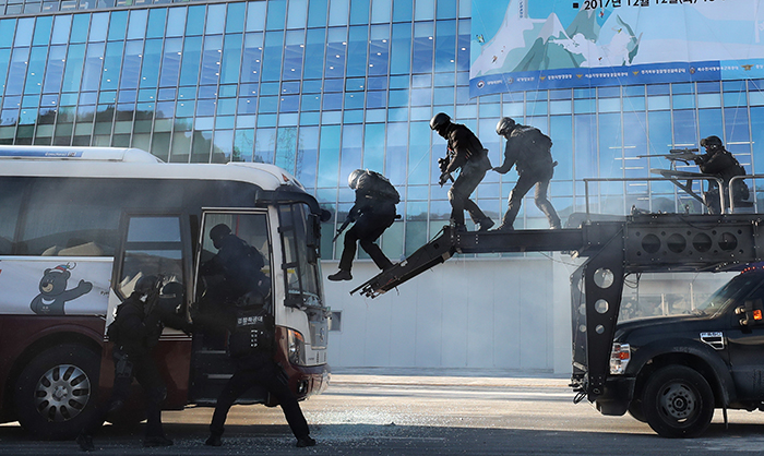 A police special forces unit carries out a drill to rescue a hostage, during a national anti-terrorism drill at the PyeongChang Olympic Plaza, Gangwon-do Province, on Dec. 12.