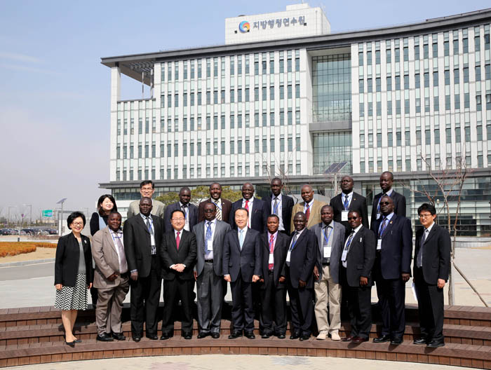 Uganda and LOGODI officials pose for a photo in front of LOGODI headquarters in Wanju-gun County, Jeollabuk-do.