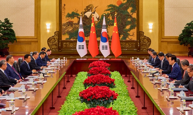 President touts 'irreversibly solidified' ties to top Chinese off...