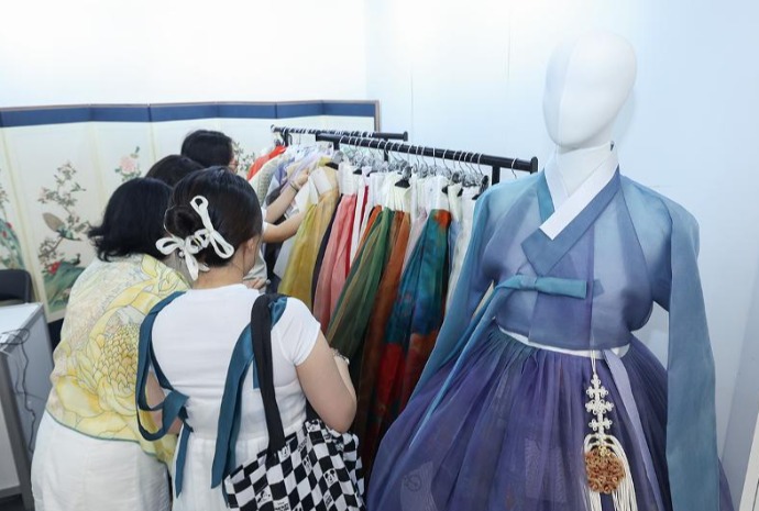 Viewing outfits at annual Hanbok Expo