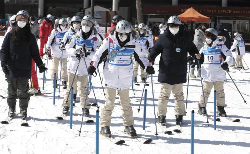 Participants in the 18th Dream Program follow their ski instructor's guidance