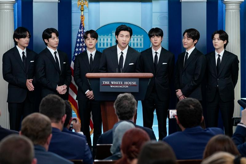 BTS leader RM (middle) on May 31 speaks to reporters at the White House's briefing room in Washington. From left are V, Jungkook, Jimin, RM, Jin, J-Hope and Suga. (Yonhap News