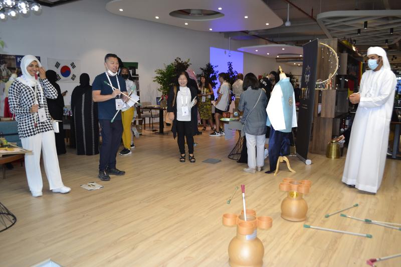 Visitors play the traditional Korean game tuho (pitch-pot) at the Korean booth of the Cultural Expo at Concept Plus in Al Quoz. 