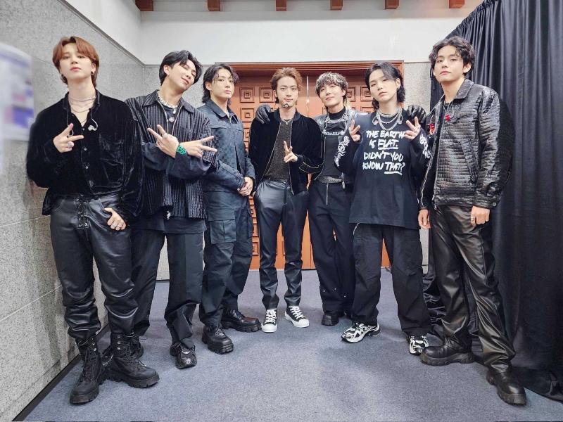 BTS members on Oct. 15 pose for a photo before performing at their 