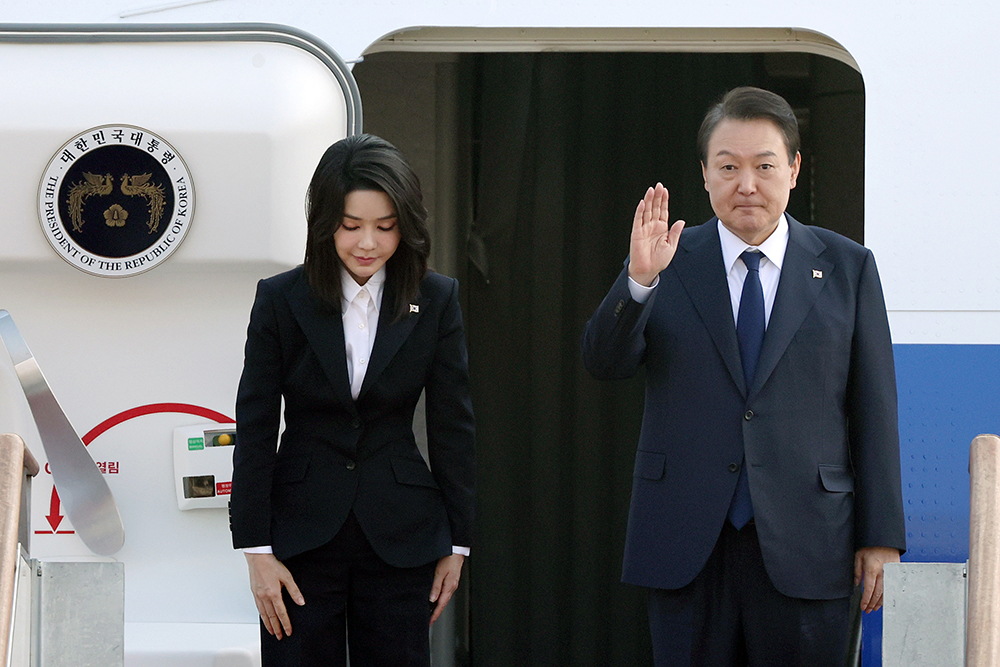 President Yoon Suk Yeol and first lady Kim Keon Hee on Nov. 11 say bye before boarding the presidential plane Code One at Seoul Air Base in Seongnam, Gyeonggi-do Province. 