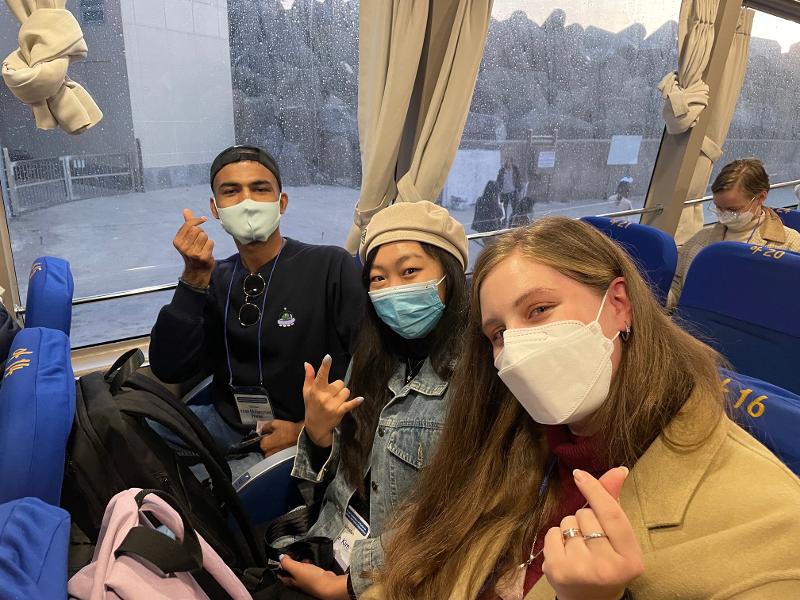 Honorary Reporters on Nov. 3 at 7:20 a.m. look excited and make the heart finger gesture on their boat ride from Ulleungdo to Dokdo. From left are Khan Muhammad Waqus from Pakistan, Olga Kim from Kazakhstan and Iuliia Mogyko-Song from Ukraine.