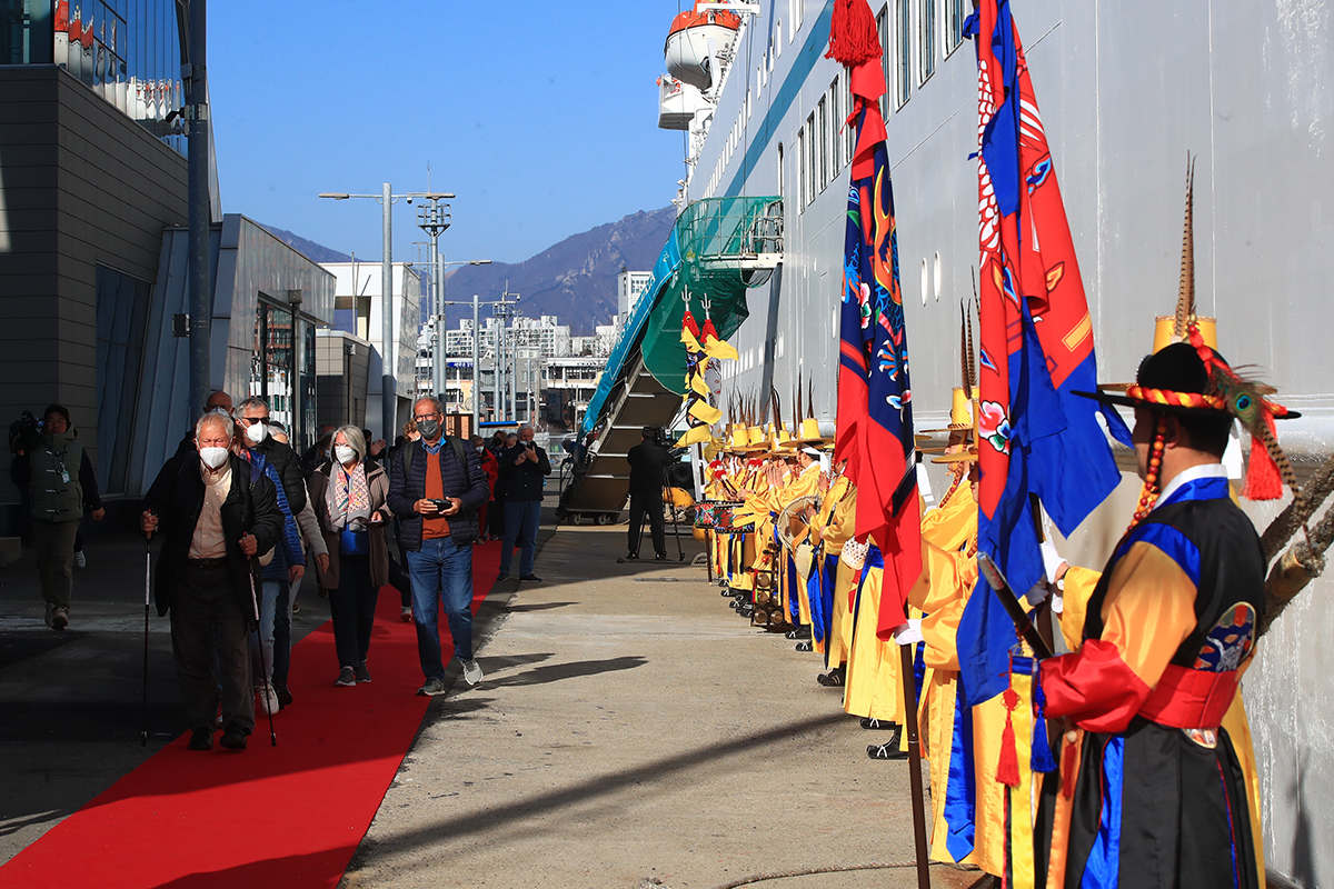 Tourists at the international cruise terminal of the Port of Sokcho in Sokcho, Gangwon-do Province, on the morning of March 13 disembark from the international cruise ship Amadea.