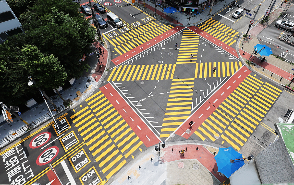A yellow crosswalk on July 3 is painted at an interaction in a school zone near Gugal Elementary School in Giheung-gu District of Yongin, Gyeonggi-do Province.