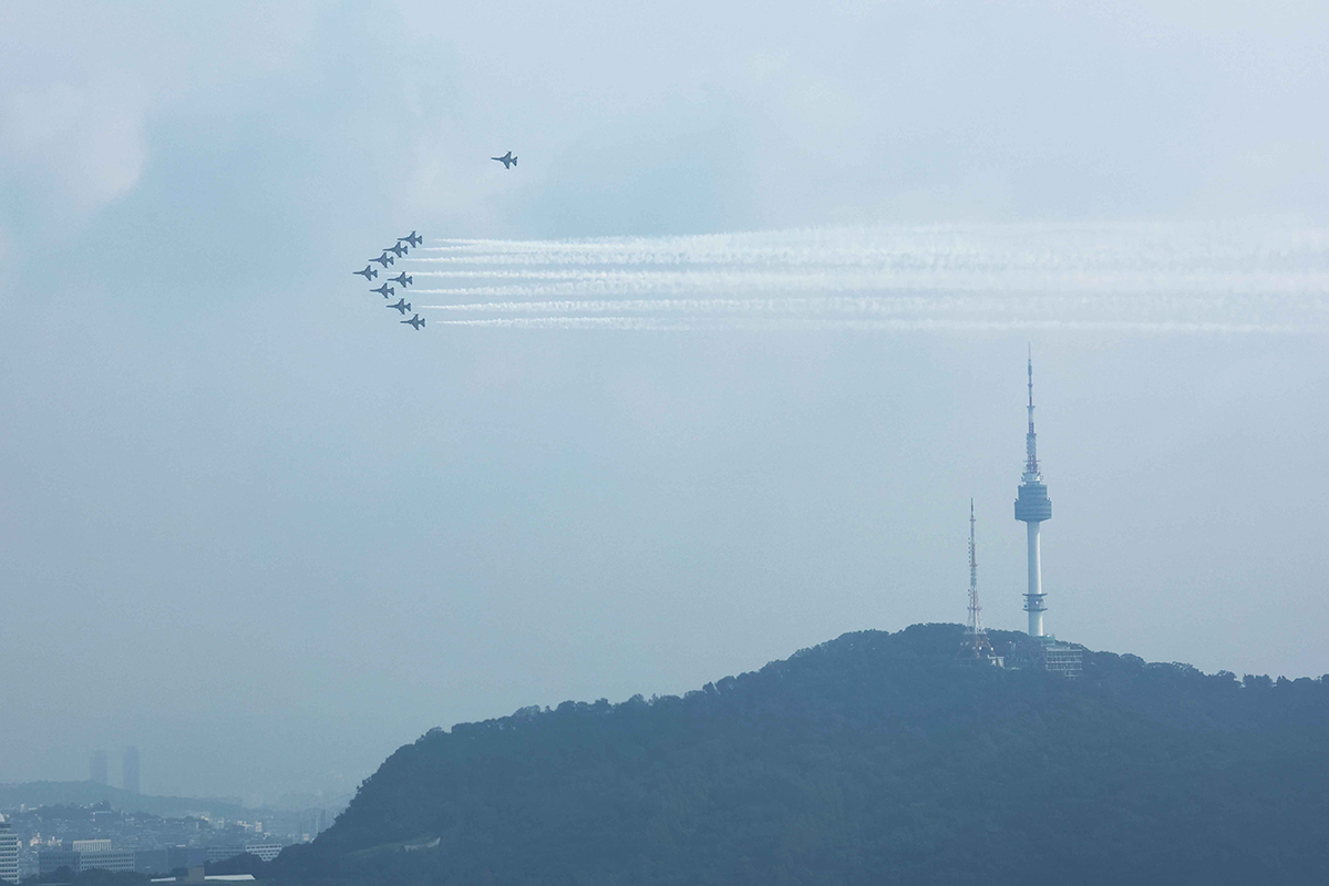 Planes of the Republic of Korea Air Force's aerobatics flight team Black Eagles on the morning of Aug. 31 hold a celebratory drill above Seoul ahead of Armed Forces Day the next day.