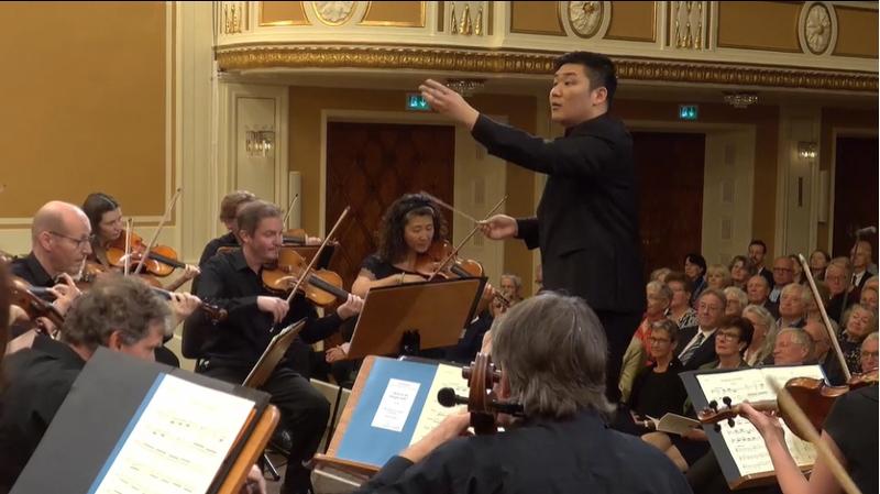 Yoon Hankyeol, the winner of this year's Herbert von Karajan Young Conductors Award, on Aug. 6 competes in the competition's final round at the main auditorium of the Mozarteum Foundation in Salzburg, Austria. (Screen capture from Salzburg Festival's website) 