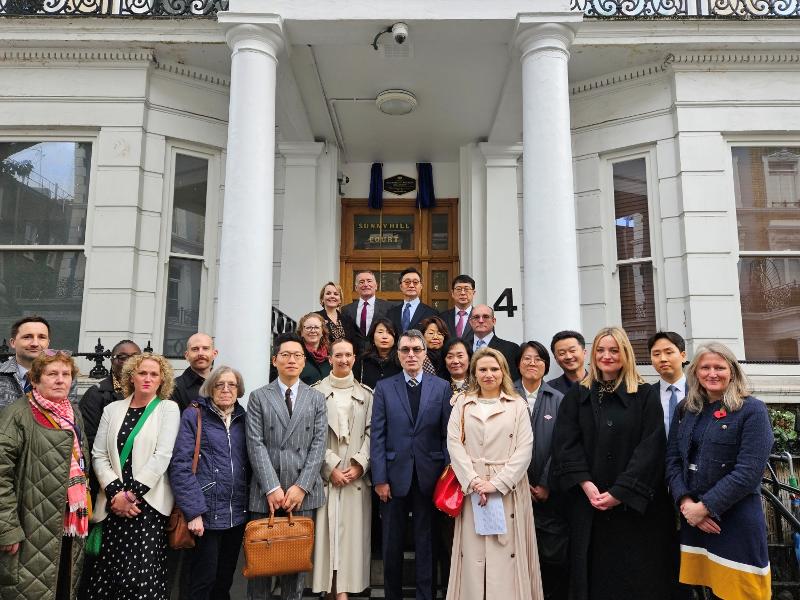 Those attending the Oct. 30 unveiling ceremony of the sign of the Korean Empire's legation at Sunny Hill Court in Earl's Court, a district of Kensington in the Royal Borough of Kensington and Chelsea in West London, pose for a photo.