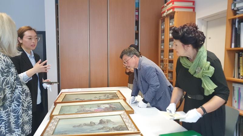 Researcher Jina Nam (second from left) on May 10 checks Korean cultural heritage with officials at the National Museum in Krakow, Poland. (Jina Nam)