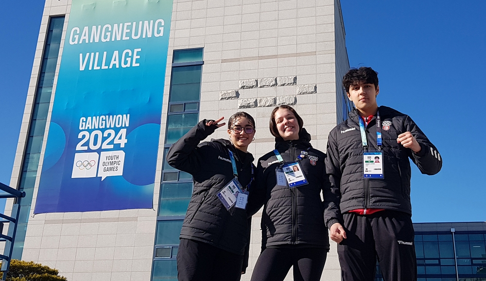 Tunisian national athletes Beya Mokrani (left), Sophie Ghorbal (middle) and Jonathan Lourimi (right) pose for a photo on Jan. 15 in front of the athletes' village at Gangneung-Wonju National University in Gangneung, Gangwon-do Province. 