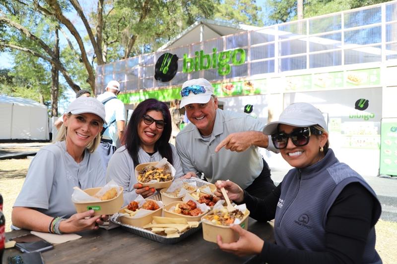 Golf fans on Oct. 20, 2022, pose for a photo with Korean food at the U.S. PGA Tour event CJ Cup at Congaree Golf Club in Ridgeland, South Carolina. (CJ CheilJedang)