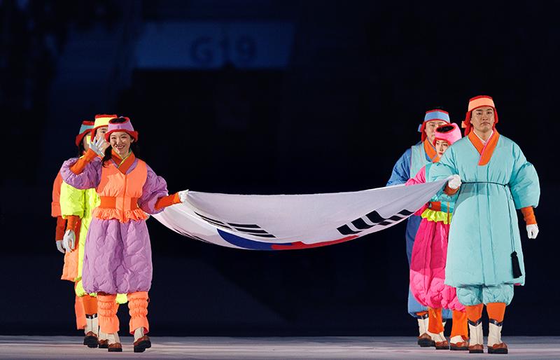 Carrying their national flag Taegeukgi, Team Korea dressed in winter Hanbok (traditional costumes) on Jan. 19 enters Gangwon 2024's opening ceremony at the Gangneung Oval in Gangneung, Gangwon-do Province. They also wear traditional jobawi (winter hats) and pungcha (caps) from the Joseon Dynasty made of traditional quilts for extra warmth.