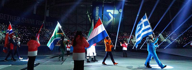 The flag bearers of Gangwon 2024's participating countries on Jan. 19 enter the Gangneung Oval in Gangneung, Gangwon-do Province, the site of the opening ceremony. 