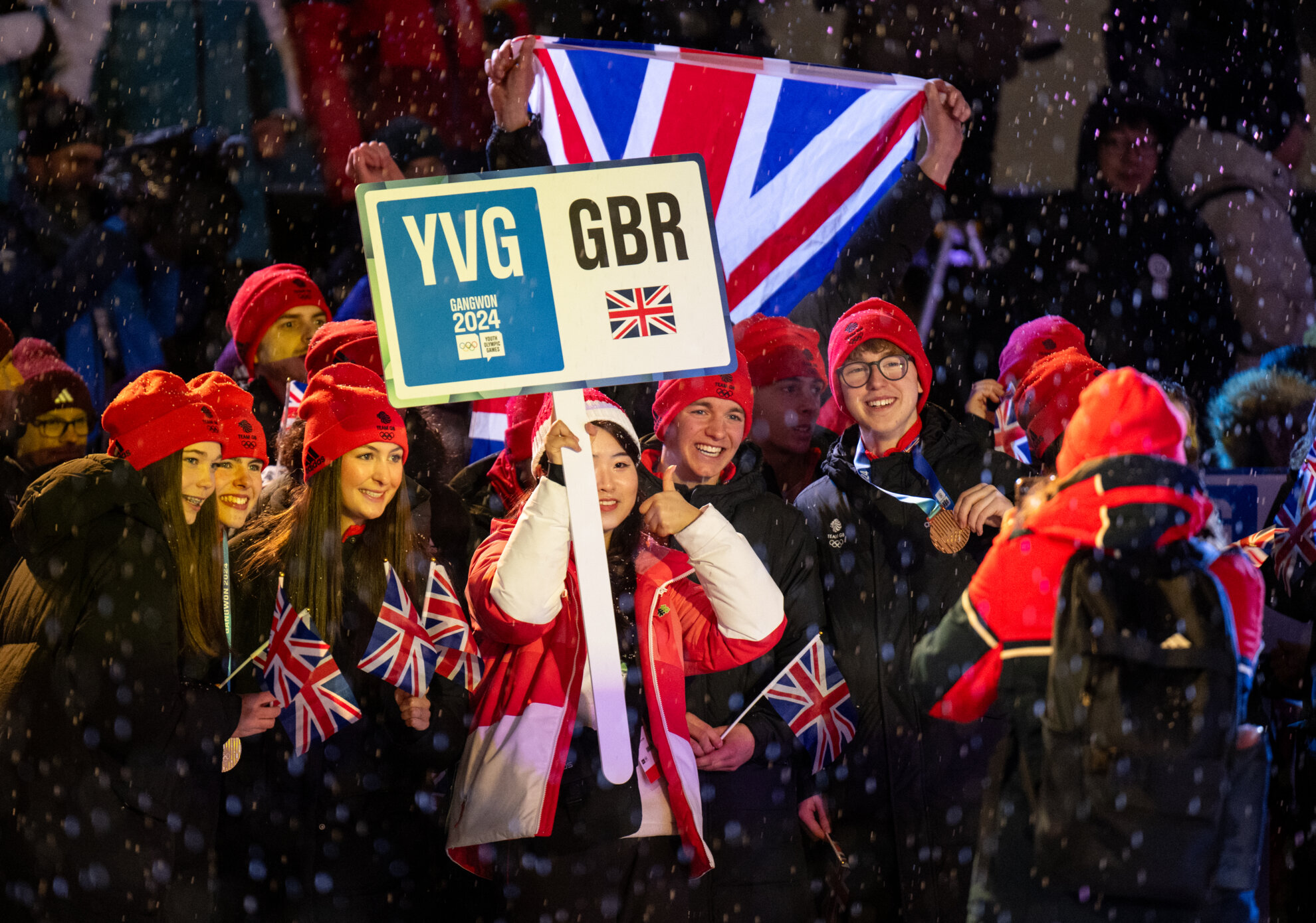 Athletes from the U.K. on Feb. 1 pose for a photo ahead of Gangwon 2024's closing ceremony in the athletes' village in Gangneung, Gangwon-do Province.