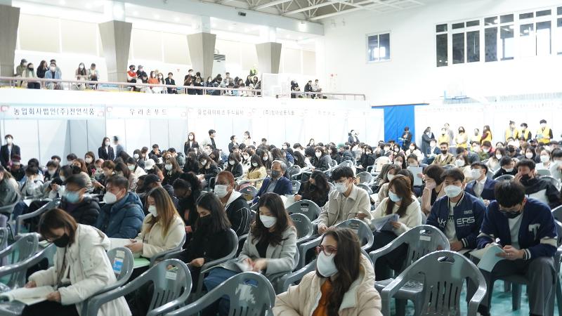 People at a job fair for international students with region-specific visas on March 17, 2023, listen to the organizer's explanation at the gymnasium of Daegu University in Daegu. (Gyeongsangbuk-do Province) 